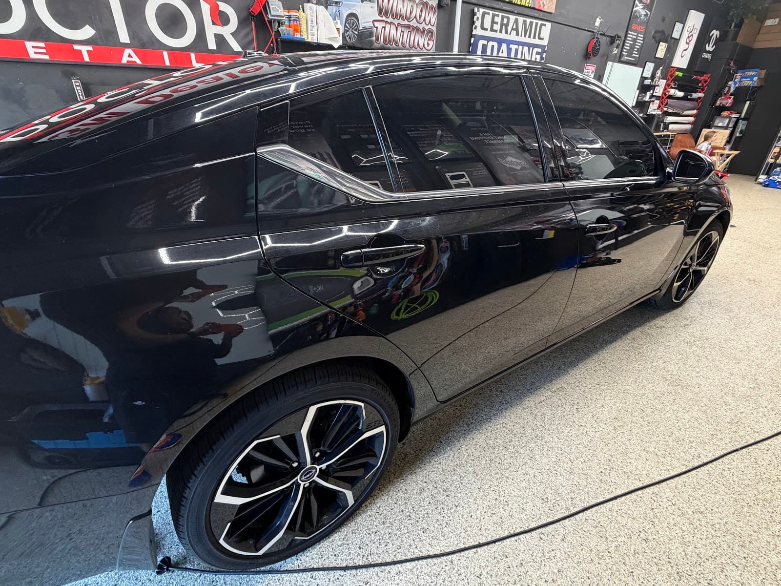 Window tinting on black sedan — Doctor Detail Eagan MN