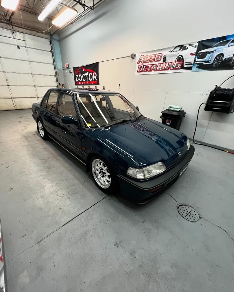 Dark blue Honda Civic sedan in Doctor Detail shop — Eagan MN