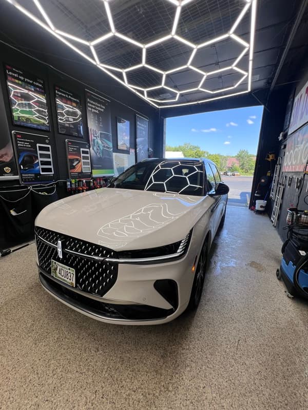 Luxury SUV in Doctor Detail shop — Eagan MN