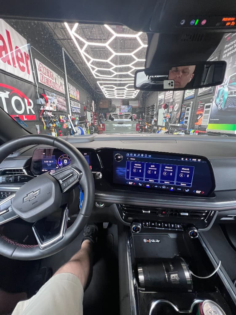 Chevrolet interior dashboard and infotainment during interior detail at Doctor Detail shop — Eagan MN