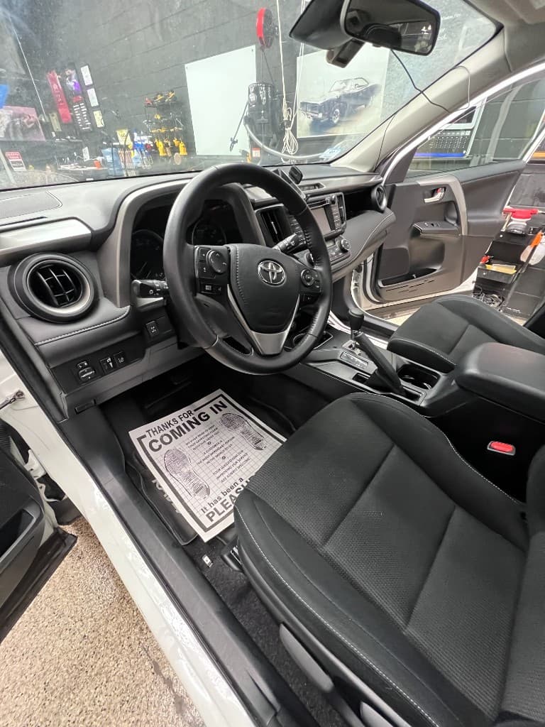 White Toyota RAV4 interior detail driver side — Doctor Detail Eagan MN