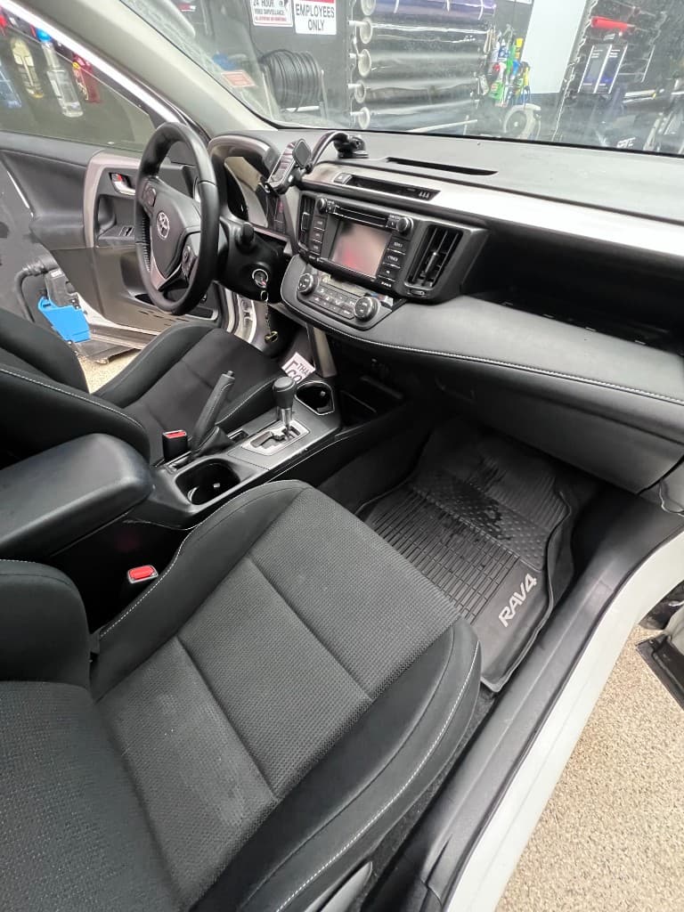 White Toyota RAV4 interior detail passenger side — Doctor Detail Eagan MN